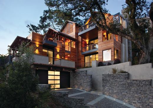 SB Architects accommodated steep terrain by designing a vertically oriented house that plays off the topography. Abundant outdoor spaces extend the living area far beyond its 2,116 square feet.