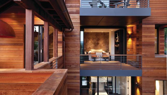 Western red cedar cladding and other natural accents blend with metal railings and an overall design simplicity to lend a rustic-yet-modern feel to Hillside House.