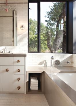 Rope handles for the bath cabinetry are among the home's many unique finishing touches. Concrete countertops from Concreteworks contain 74% post-consumer recycled glass and 15% fly ash.