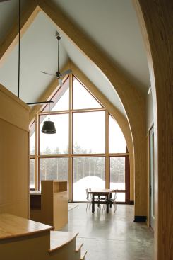 Baby It's Cold Outside But not in here. Concrete floors and SIP walls retain the sun's heat in winter. Graceful bow arch beams and millwork of Southern yellow pine add visual warmth.