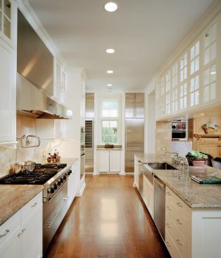 The walls of windows, double-sided glass cabinets, and framed views into other rooms that enrich this Glencoe, Ill., house appear throughout the firm’s work. The architects tucked the home's entry into a corner niche, sheltering it from the elements.