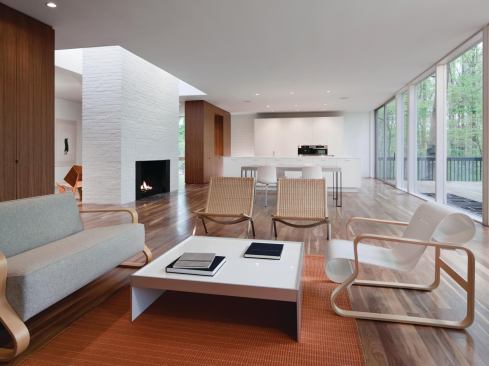 An allee of walnut casework defines the public areas.


