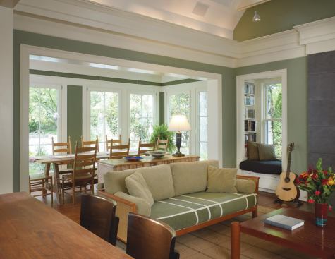 The breakfast room sits within an enclosed portion of the new rear porch built on the back of the family room.