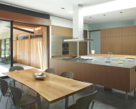 Counter space, concentrated at the two islands, is lit from above by a large skylight.

