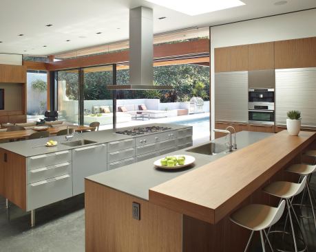 This remodeled kitchen doubles as an informal screening room for an owner who works in the film industry.

