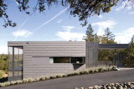 Strong geometrical forms and soft, muted colors give this new house an assertive yet respectful presence in its rural landscape.