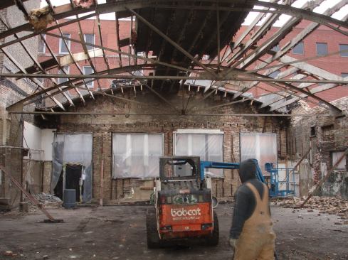 Demo and excavation posed big challenges. To keep both façade and interior masonry intact, temporary steel bracing was installed on the inside of the four-sided lot-line.  Two floors of crumbling masonry and a large 50' long x 50' wide stretch of steel bow-string truss roof structure were able to be taken apart. 