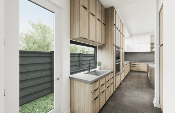 Directly off the main kitchen but tucked away behind a wall, the prep kitchen includes the pantry, a serving niche with a sink, and ample cabinetry. 