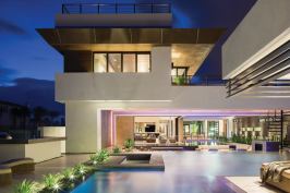 Almost every room in the 2013 New American Home has a view to outdoor spaces, from desert- and Asian-inspired courtyards to water features, landscaping, and both private and public entertainment areas. That mix reinforces the indoor-outdoor intent of the house—an effect enabled by telescoping patio doors that pocket out of sight for seamless transitions.